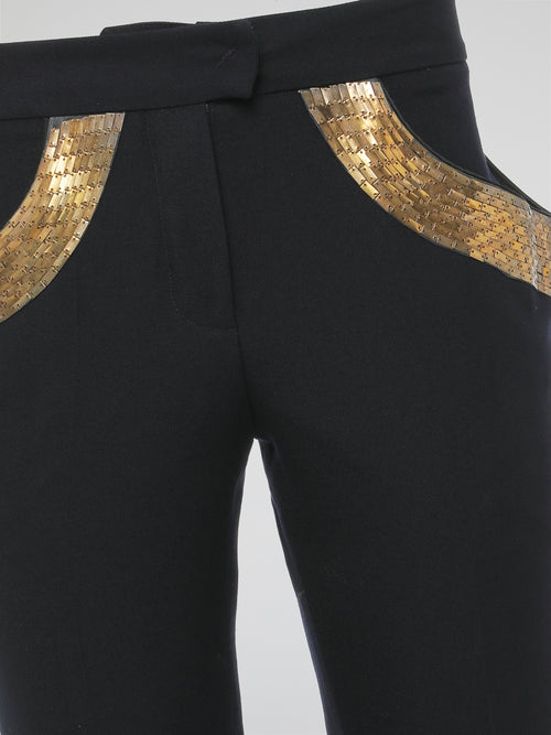 Step into elegance with these stunning Black Embellished Trousers by Roberto Cavalli. Crafted with meticulous care, each detail on these trousers tells a story of sophistication and luxury. From the delicate beaded embellishments to the figure-flattering silhouette, these trousers are a fashion statement that exudes confidence and style.