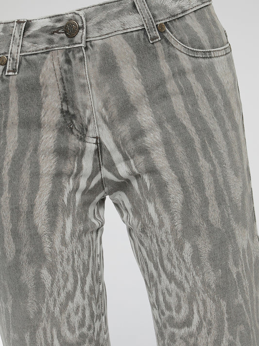 Step into the wild side of fashion with Roberto Cavalli's Animal Print Jeans, a fierce and daring addition to your denim collection. Crafted with impeccable precision, these jeans effortlessly fuse a touch of untamed allure with a classic silhouette. Showcasing the iconic Cavalli style, these statement pieces promise to bring out your inner fashion predator wherever you go.