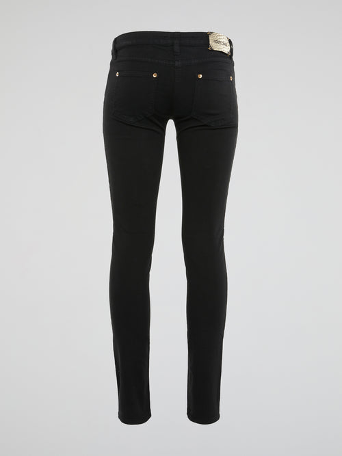 Elevate your style with these sleek and edgy Black Skinny Jeans by Roberto Cavalli - crafted for the fashion-forward individual who isn't afraid to make a bold statement. The figure-hugging fit and luxe detailing will have heads turning wherever you go, effortlessly taking you from day to night in style. Embrace your inner trendsetter with these must-have jeans that exude confidence and sophistication.