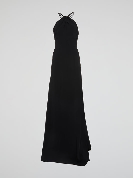 Transport yourself to the ultimate glamorous oasis with this stunning Black Halter Neck Maxi Dress from Roberto Cavalli. Crafted with luxurious materials and featuring a flattering halter neck design, this dress is guaranteed to turn heads at any event. Add a touch of elegance and sophistication to your wardrobe with this show-stopping piece that will make you feel like a true fashion icon.