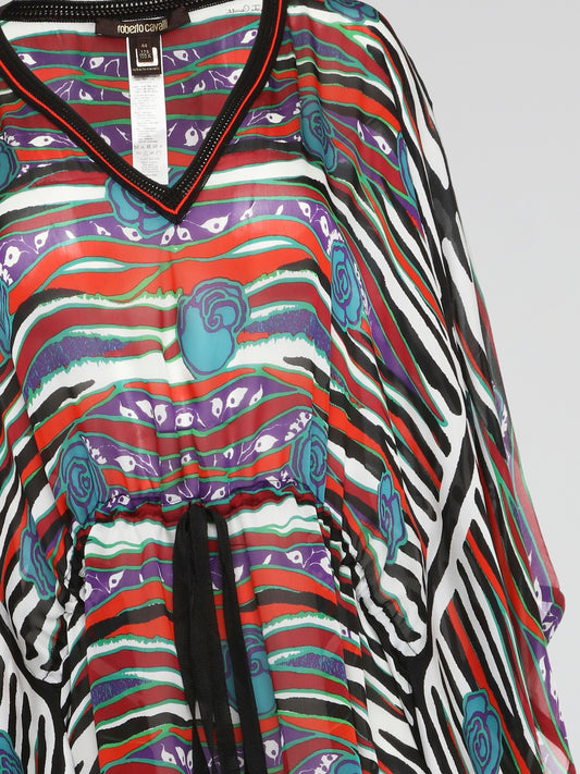 Elevate your summer style with the exquisite Printed V-Neck Kaftan by Roberto Cavalli. Crafted from luxurious materials, this kaftan features a stunning, eye-catching print that will turn heads wherever you go. Perfect for lounging by the pool or sashaying down the beach, this kaftan is a must-have for any fashion-forward individual.