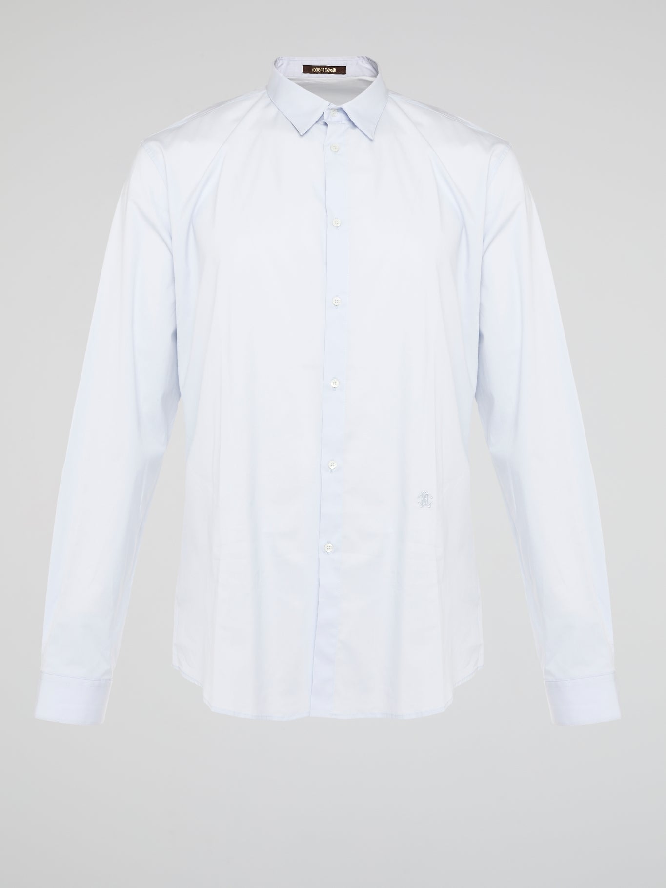 Elevate your wardrobe with the effortlessly chic White Long Sleeve Shirt by Roberto Cavalli. Crafted from luxurious fabric with impeccable attention to detail, this versatile piece exudes sophistication and glamour. Embrace a timeless look that seamlessly transitions from day to night with this must-have staple.