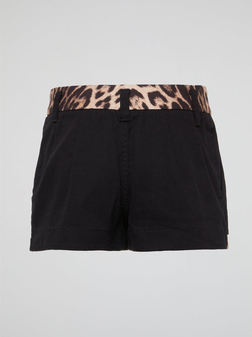 Unleash your inner wild side with these fierce Black Leopard Trim Shorts by Roberto Cavalli. Made for the fashion-forward individual who isn't afraid to stand out in a crowd, these shorts feature a bold leopard print trim that adds a touch of edgy sophistication to any outfit. Whether you're hitting the town or lounging at home, these shorts are sure to turn heads and make a statement wherever you go.