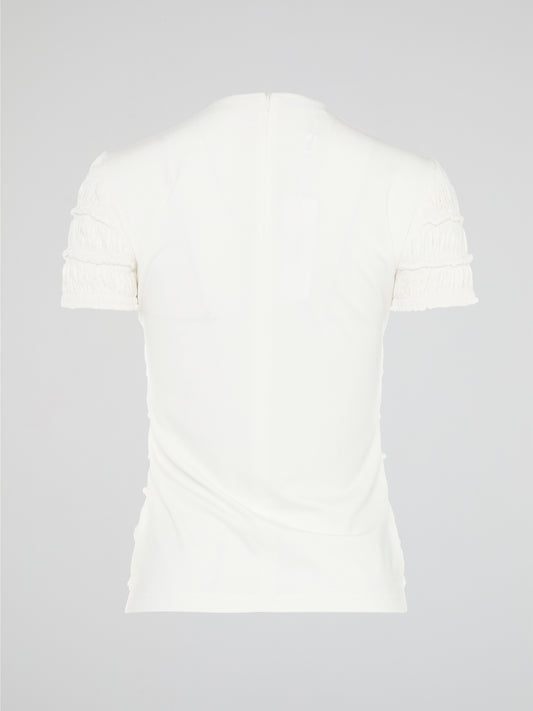 The White Tiered Top from Akris Punto is a captivating blend of sophistication and whimsy. With its unique tiered design, this versatile top adds a playful twist to any outfit. Made from premium materials, it effortlessly drapes to flatter your figure and is perfect for both casual and formal occasions.