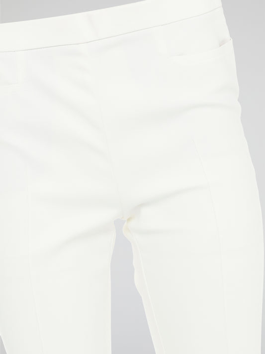 Get ready to turn heads with these stunning White Skinny Fit Trousers by Akris Punto! Designed to flatter every curve, these trousers hug your body in all the right places, giving you a sleek and elegant silhouette. Perfect for both casual and formal occasions, these versatile pants are a must-have addition to your wardrobe!