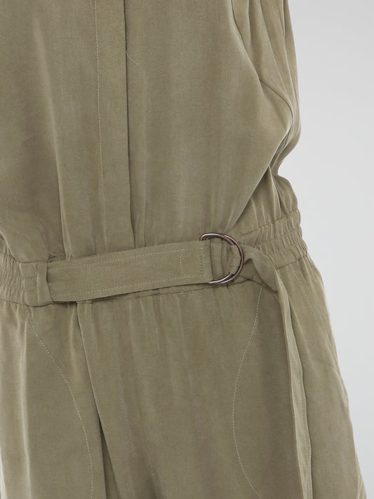 Step into effortless style with the Khaki Belted Jumpsuit from Akris Punto. This chic and versatile piece combines the sophistication of a tailored jumpsuit with the comfort of a belted waist, offering you the best of both worlds. Whether you're heading to the office or out for a night on the town, this jumpsuit is the epitome of modern elegance that will make heads turn wherever you go.