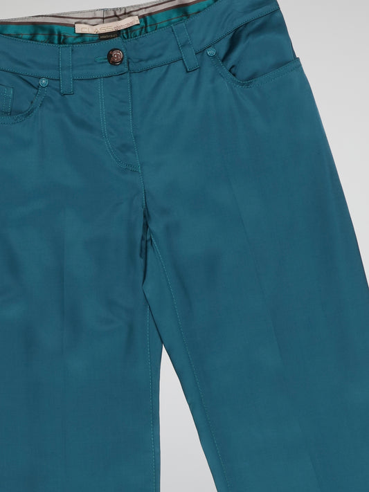 Get ready to turn heads with these Teal Wide Leg Pants by Clas Roberto Cavalli! The vibrant teal color adds an element of boldness to your outfit, while the wide leg design effortlessly exudes a chic and sophisticated vibe. Crafted with the utmost attention to detail, these pants ensure both comfort and style, perfect for any occasion.