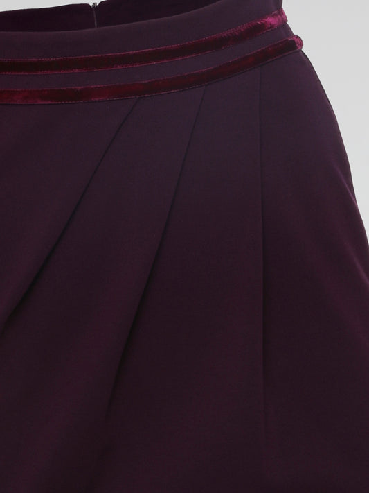 Introducing the Burgundy Draped Skirt by Roberto Cavalli, a graceful masterpiece that effortlessly captivates attention. Crafted with meticulous precision, this luxurious skirt embraces the spirit of elegance, featuring cascading layers that dance with every step. Emanate sophistication and allure as you glide across the room, leaving a trail of admiration in your wake.