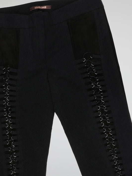 Step into elegance with these stunning Black Embellished Trousers by Roberto Cavalli. Crafted with meticulous care, each detail on these trousers tells a story of sophistication and luxury. From the delicate beaded embellishments to the figure-flattering silhouette, these trousers are a fashion statement that exudes confidence and style.