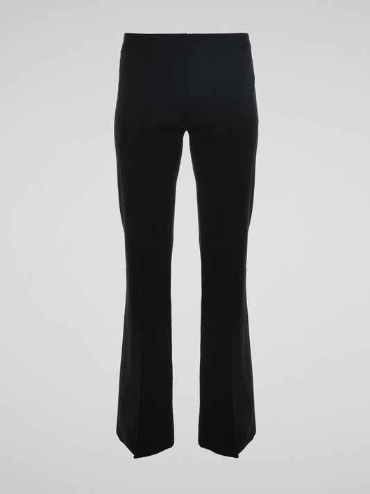 Step into the world of effortless glamour with these Black Flared Trousers by Roberto Cavalli. Crafted with meticulous precision, these trousers boast a striking silhouette that elegantly skims the figure, accentuating every curve. From the office to a night out, these trousers are a timeless wardrobe staple designed to make a bold fashion statement.