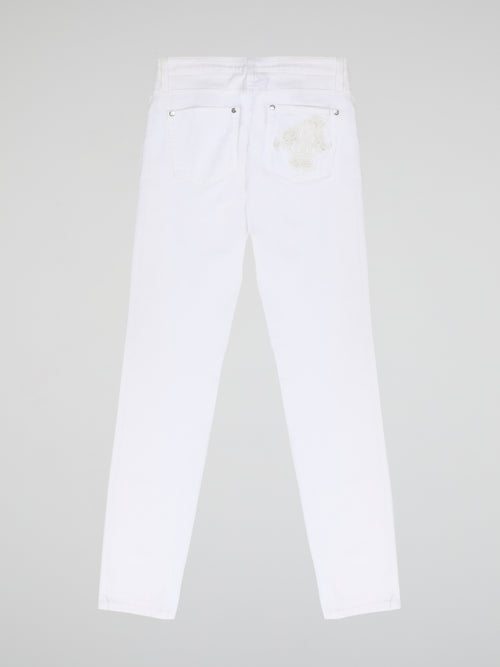 Turn heads and elevate your style with our White Straight Cut Jeans by Roberto Cavalli. Crafted with precision and attention to detail, these jeans feature a sleek and modern design that embodies sophistication and confidence. Whether you're strolling through the city or hitting the beach, these jeans are sure to make a statement and redefine your fashion game.