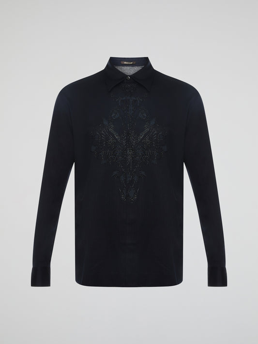 Step into the realm of effortless elegance with the captivating Black Embroidered Shirt by Roberto Cavalli. Adorned with intricate embroidery and delicate lace details, this shirt is a mesmerizing fusion of sophistication and sensuality. Elevate your style with this statement piece that exudes an air of mystique and timeless allure.