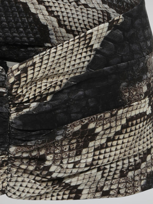 Add a touch of fierce elegance to your outfits with the mesmerizing Snake Print Belt from Roberto Cavalli. Crafted with meticulous attention to detail, this accessory combines edginess and sophistication effortlessly. Let the hypnotic pattern wrap around your waist, instantly transforming any ensemble into a show-stopping masterpiece.