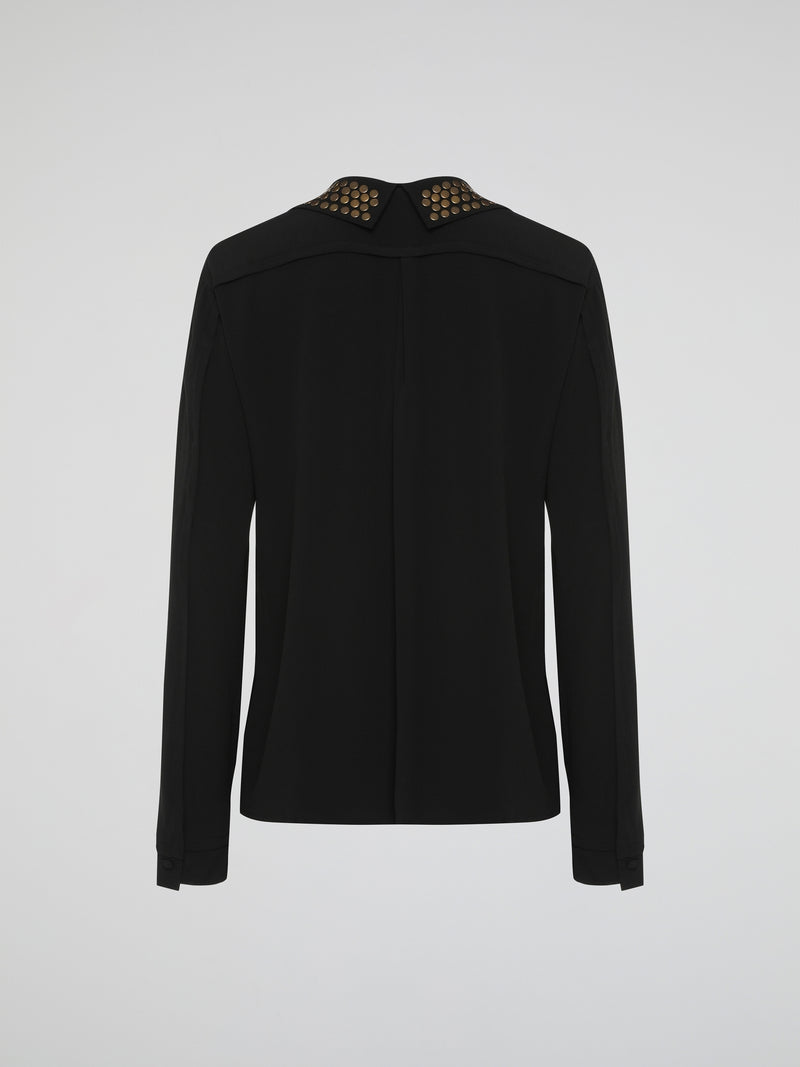 Step into the world of fierce elegance with the Black Studded Collar Blouse by Roberto Cavalli. This extraordinary piece effortlessly combines edgy appeal with timeless sophistication, making it a versatile addition to any wardrobe. With its luxurious fabric, daring studded collar, and impeccable craftsmanship, this blouse is a bold statement that exudes confidence and pushes boundaries.