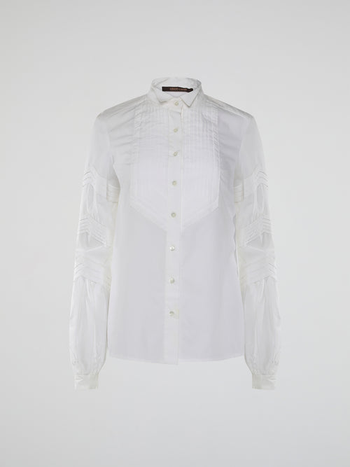 Step into the world of timeless elegance with the White Pleated Bib Shirt from Roberto Cavalli. Crafted with meticulous attention to detail, this masterpiece combines effortless sophistication with a touch of whimsical charm. From its delicate pleated bib to its crisp white fabric, this shirt will make a statement in any setting, exuding refined elegance that is truly captivating.