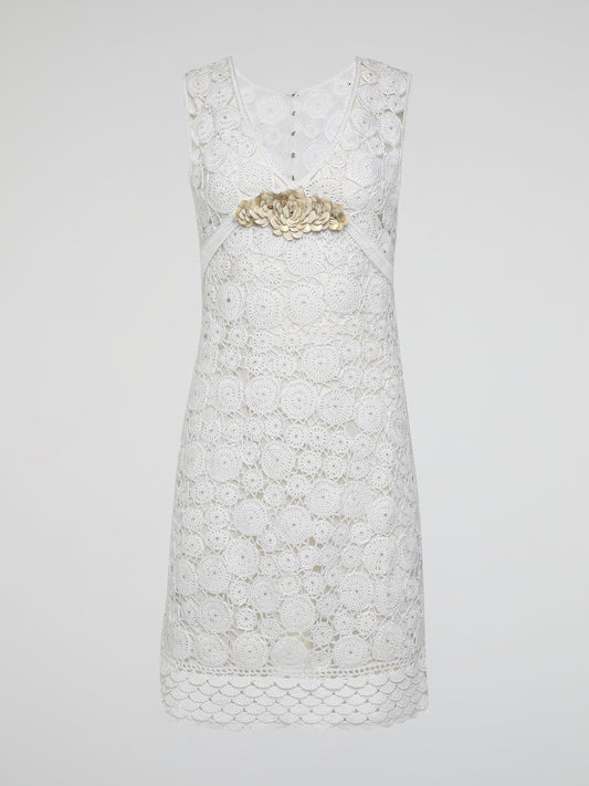 Step into the world of exquisite elegance with this captivating White Crochet Dress by Roberto Cavalli. Crafted with meticulous attention to detail, this dress channels the essence of femininity, showcasing delicate crochet patterns that gracefully embrace your silhouette. Whether you're attending a garden soiree or a beachfront dinner, this dress effortlessly combines timeless charm with modern flair, making you the epitome of effortless beauty.