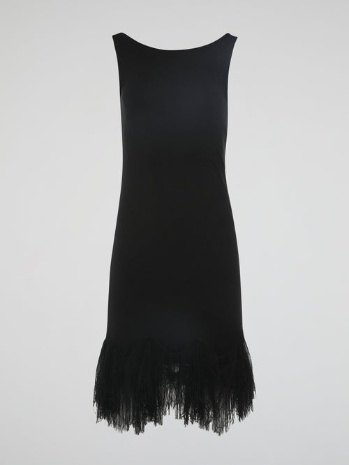 Introducing the epitome of elegance and glamour – the Black Fringe Hem Dress by Roberto Cavalli. This show-stopping piece combines the timeless sophistication of a little black dress with the playful flair of fringed details. With its figure-hugging silhouette and exquisite craftsmanship, this dress is a must-have for those seeking to make a lasting impression at any occasion.