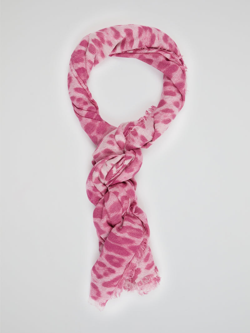 Wrap yourself in the wild elegance of this Pink Animal Print Scarf by Roberto Cavalli. The luxurious blend of soft fabric showcases a mesmerizing array of rosy hues, adorned with a fierce and playful animal motif. With each drape, let this statement accessory unleash your inner fashion safari, captivating attention wherever you go.