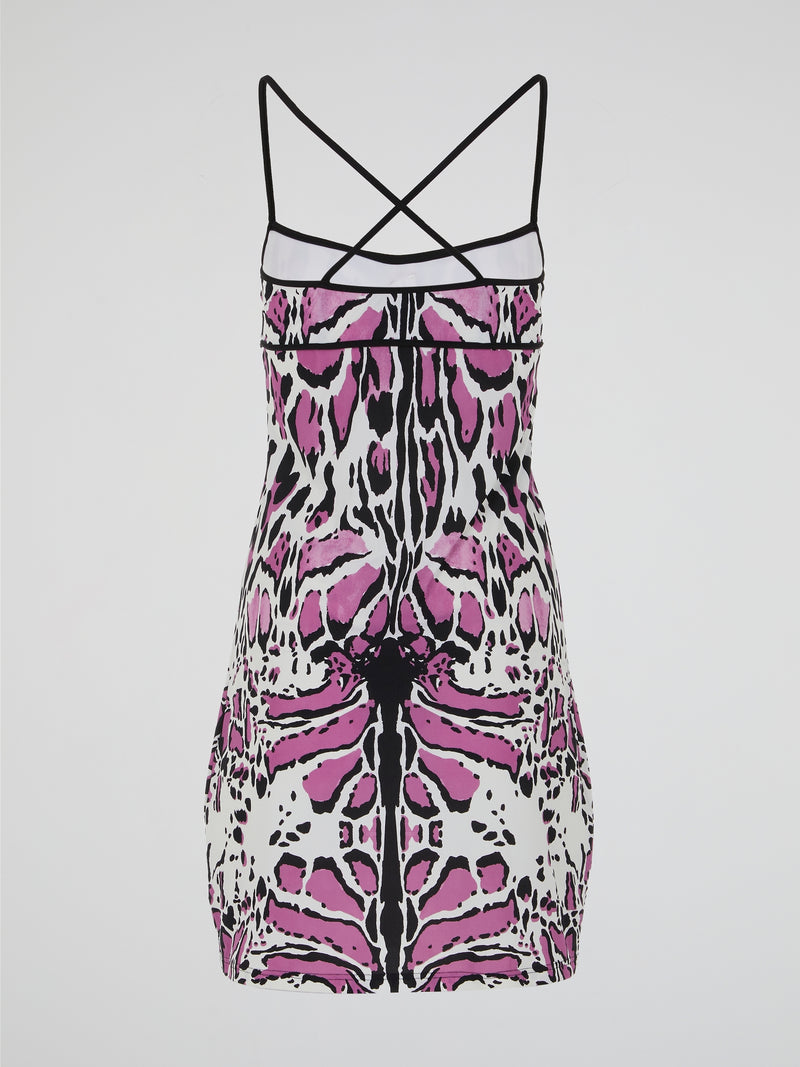 Unleash your wild side with the Animal Print Strap Dress by Roberto Cavalli. This captivating and daring dress features a mesmerizing print that evokes the untamed spirit of the jungle. The sleek and flattering silhouette, coupled with the luxurious fabric, makes it a fierce and fashionable choice for any occasion.