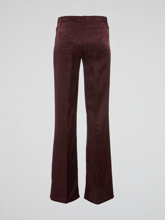 Step up your fashion game with these Burgundy Flared Pants by Clas Roberto Cavalli. Crafted from luxurious materials, these pants offer a sleek and chic silhouette with a touch of retro flair. Perfect for both formal and casual occasions, they effortlessly elevate any outfit, making you the style icon wherever you go.