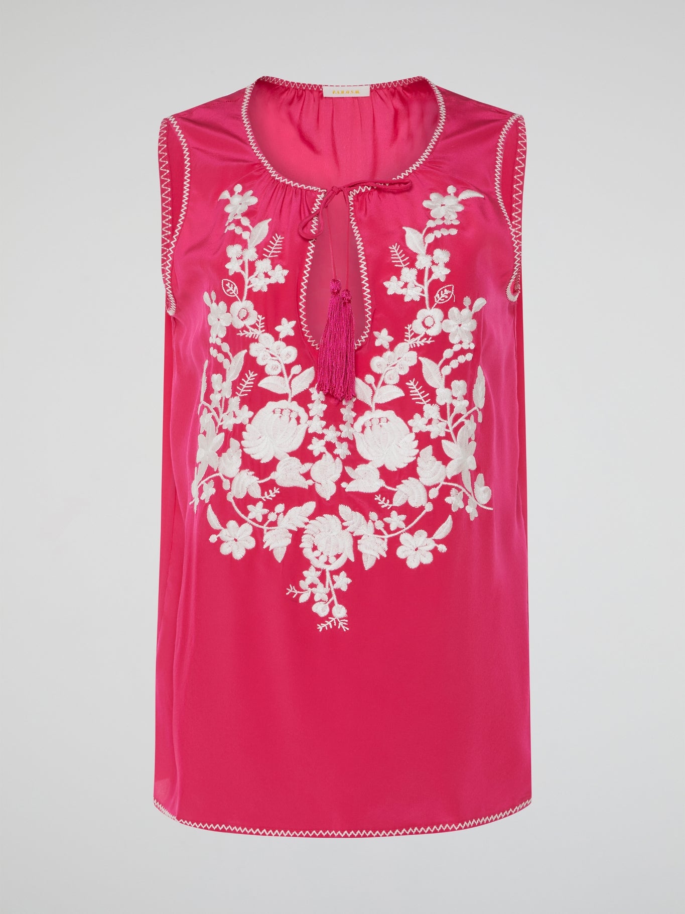 Step into a blooming sanctuary of style with our Pink Floral Embroidered Top by Parosh. Delicately crafted with love, vibrant embroidery dances across the fabric, transforming this ordinary top into a work of wearable art. As you slip it on, you'll instantly feel like you're strolling through a lush garden, ready to turn heads and embrace your inner flower goddess.