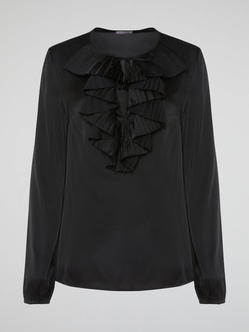 Introducing the Black Ruffle Bib Blouse by Parosh, where timeless elegance meets playful charm. Crafted with utmost precision, this statement piece features a beautifully sculpted ruffle bib that adds a touch of whimsy to your ensemble. With its sophisticated black hue and impeccable tailoring, this blouse is a must-have addition to your wardrobe, seamlessly elevating any outfit from day to night.