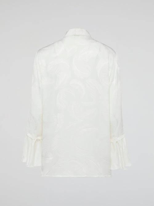 Embrace the essence of high-end fashion with the Ruffle Detailed Shirt by Roberto Cavalli. This stunning piece perfectly combines elegance and playfulness with its intricate ruffles that gracefully dance along the collar and cuffs. Crafted from luxurious materials, this shirt is a true statement piece that effortlessly elevates any outfit.