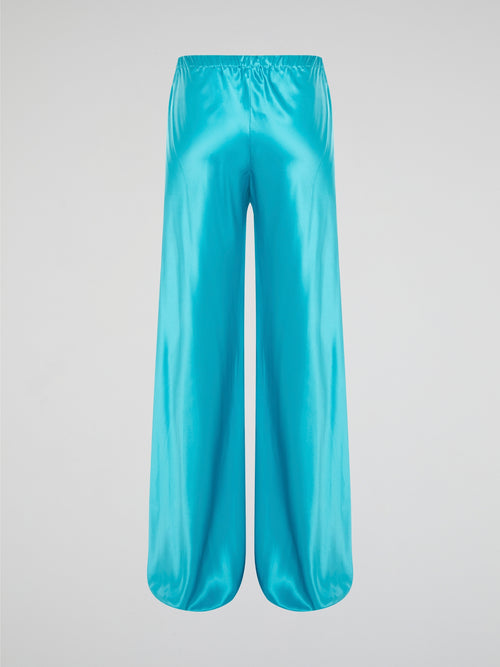 Step up your style game with these luxurious blue silk pants by Roberto Cavalli. The drawstring waist adds a casual and comfortable touch to the elegant silk fabric, making them perfect for any occasion. Stand out from the crowd and make a statement with these unique and eye-catching pants.