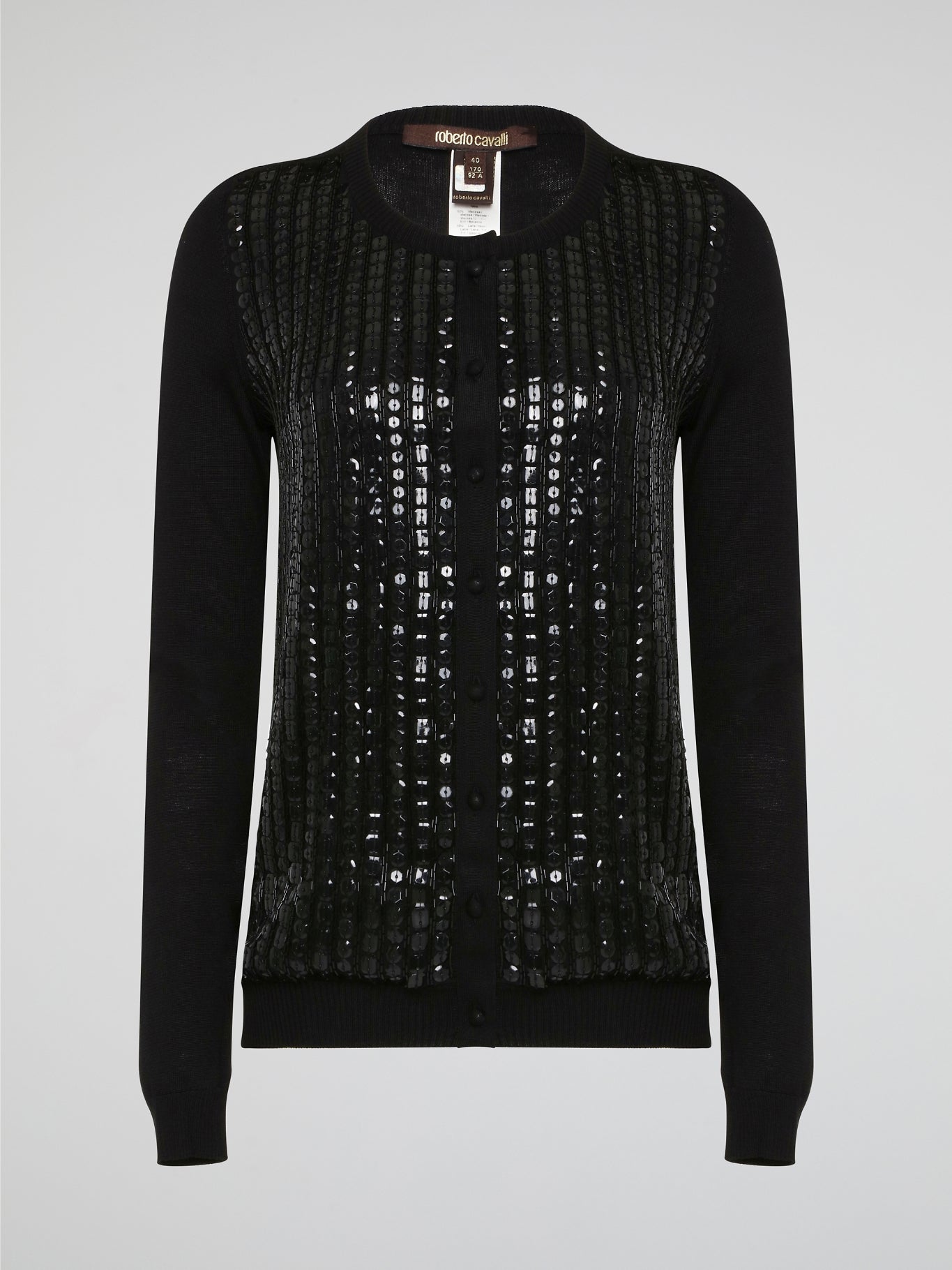 Wrap yourself in luxurious style with this Black Embroidered Cardigan from Roberto Cavalli. Featuring intricate embossed detailing that adds a touch of glamour to any outfit, this cardigan is perfect for layering in the cooler months. Elevate your wardrobe with this statement piece that is sure to turn heads wherever you go.