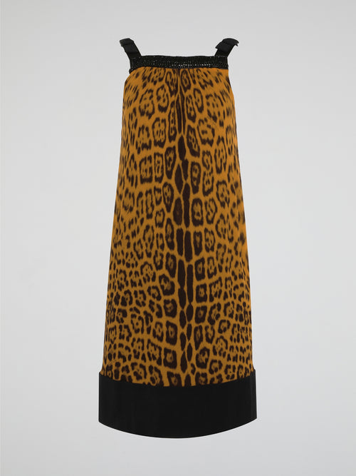 Step out in fierce style with our Brown Leopard Print Shift Dress by Roberto Cavalli. This stunning piece features a bold leopard print design in rich shades of brown, guaranteed to turn heads wherever you go. Made with high-quality materials and expert craftsmanship, this dress is the perfect choice for making a statement at any event.