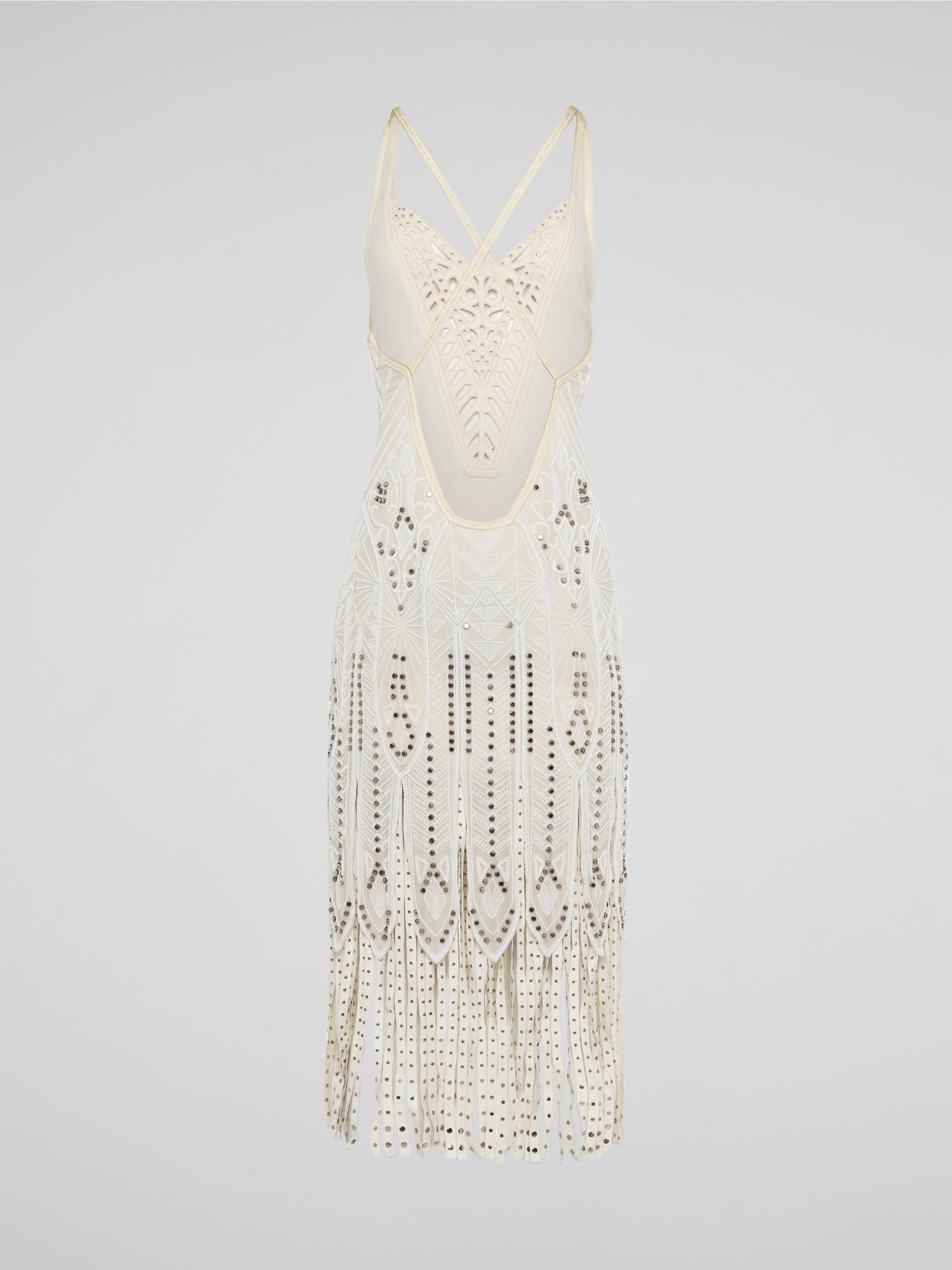 Step out in style in this stunning White Embroidered Fringe Dress from iconic designer Roberto Cavalli. The intricate embroidery detailing and playful fringe trim add a touch of bohemian elegance to this timeless piece. Whether you're hitting the beach or attending a summer soirée, this dress is sure to turn heads and make a statement.