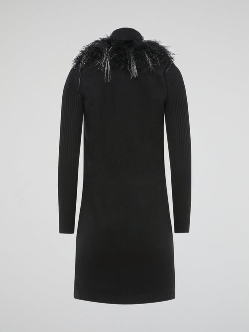 Step out in style and turn heads in our luxurious Black Faux Fur Sweater Dress by Blumarine. This fierce and fabulous dress features a soft faux fur exterior that will make you feel like a true fashionista. Whether you're hitting the town or cozying up at home, this dress is sure to make a statement and keep you warm all season long.