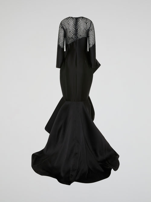 Make a statement in this stunning Black Mesh Bodice Mermaid Gown by Isabel Sanchis. The intricate mesh detailing on the bodice adds a touch of elegance, while the mermaid silhouette hugs your curves in all the right places. Perfect for a formal event or a red carpet soirée, this gown is sure to turn heads and make you feel like a true Hollywood star.