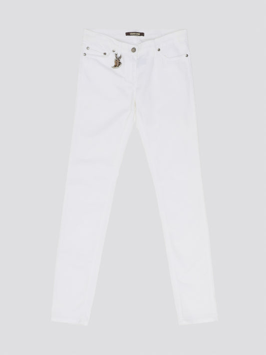 Indulge in timeless elegance and modern sophistication with these White Straight Leg Jeans by Roberto Cavalli. Crafted with precision and attention to detail, these jeans feature a sleek silhouette that effortlessly complements any ensemble. Elevate your everyday wardrobe with a touch of luxury and style with these iconic Roberto Cavalli jeans.