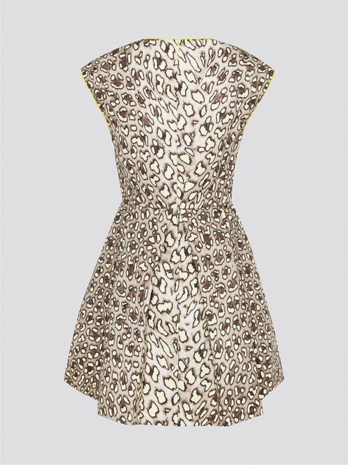 Indulge in your wild side with the Leopard Print V-Neck Mini Dress by Roberto Cavalli, a daring and chic addition to your wardrobe. This statement piece exudes fierce confidence with its bold print and flattering silhouette, perfect for a night out on the town or a special occasion. Channel your inner fashionista and stand out from the crowd in this one-of-a-kind piece by a renowned luxury designer brand.