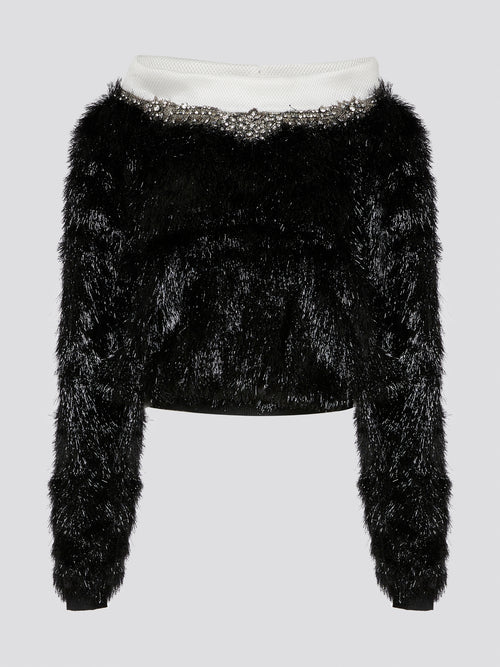 Elevate your winter wardrobe with the Crystal Embellished Faux Fur Sweater by Gemy, a luxurious and glamorous knit perfect for keeping you cozy and stylish all season long. This stunning sweater features sparkling crystal detailing that adds a touch of elegance and sophistication to any outfit. Perfect for adding a touch of winter sparkle to your look, this sweater is a must-have statement piece for any fashion-forward individual.