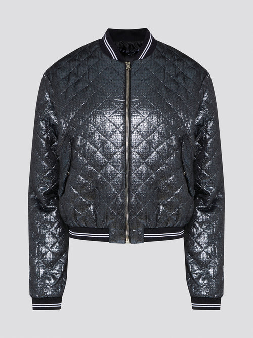 Elevate your outerwear game with the Markus Lupfer Metallic Quilted Bomber Jacket. This stunning piece combines edgy metallic fabric with classic quilted stitching for a truly unique look. Whether you're heading to a concert or a night out on the town, this jacket is sure to turn heads and make a statement.