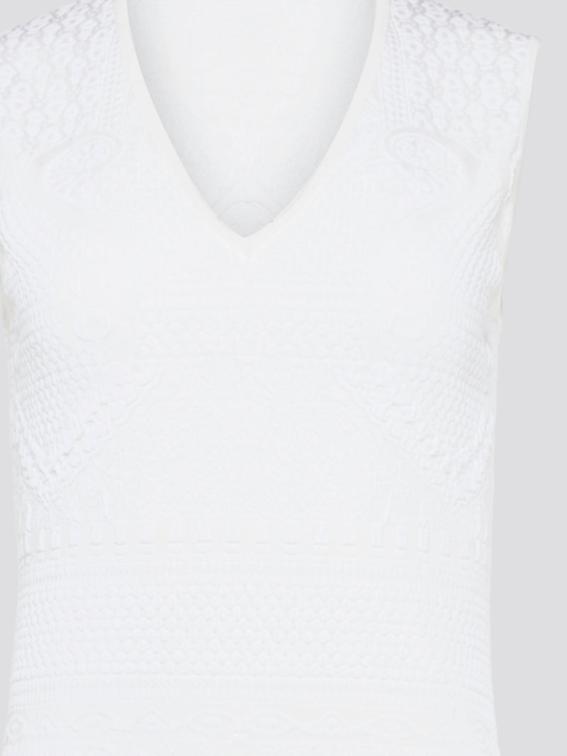 Feel effortlessly chic and sophisticated in this stunning White Sleeveless Mini Dress by Roberto Cavalli. The epitome of Italian luxury, the dress features a flattering silhouette and intricate detailing that is sure to turn heads. Perfect for any occasion, whether it's a summer soirée or a glamorous night out, this dress is a must-have for any fashion-forward woman.