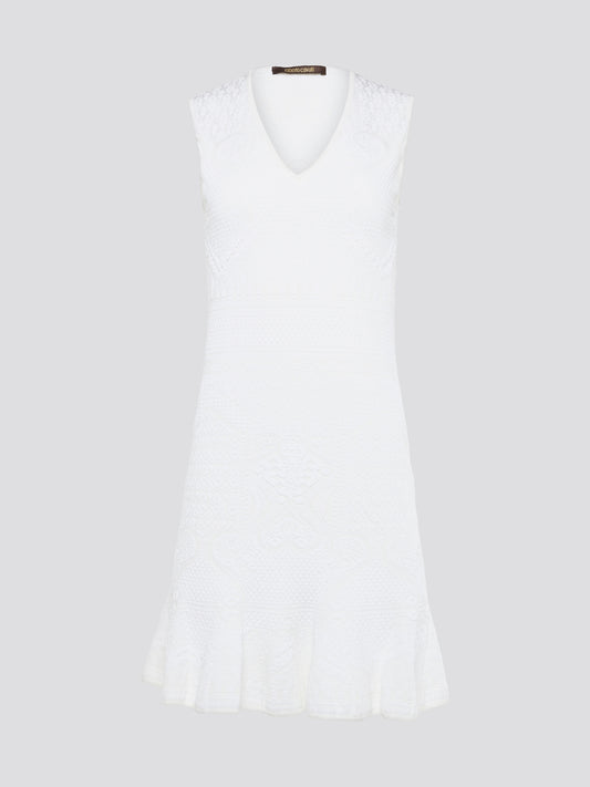 Feel effortlessly chic and sophisticated in this stunning White Sleeveless Mini Dress by Roberto Cavalli. The epitome of Italian luxury, the dress features a flattering silhouette and intricate detailing that is sure to turn heads. Perfect for any occasion, whether it's a summer soirée or a glamorous night out, this dress is a must-have for any fashion-forward woman.