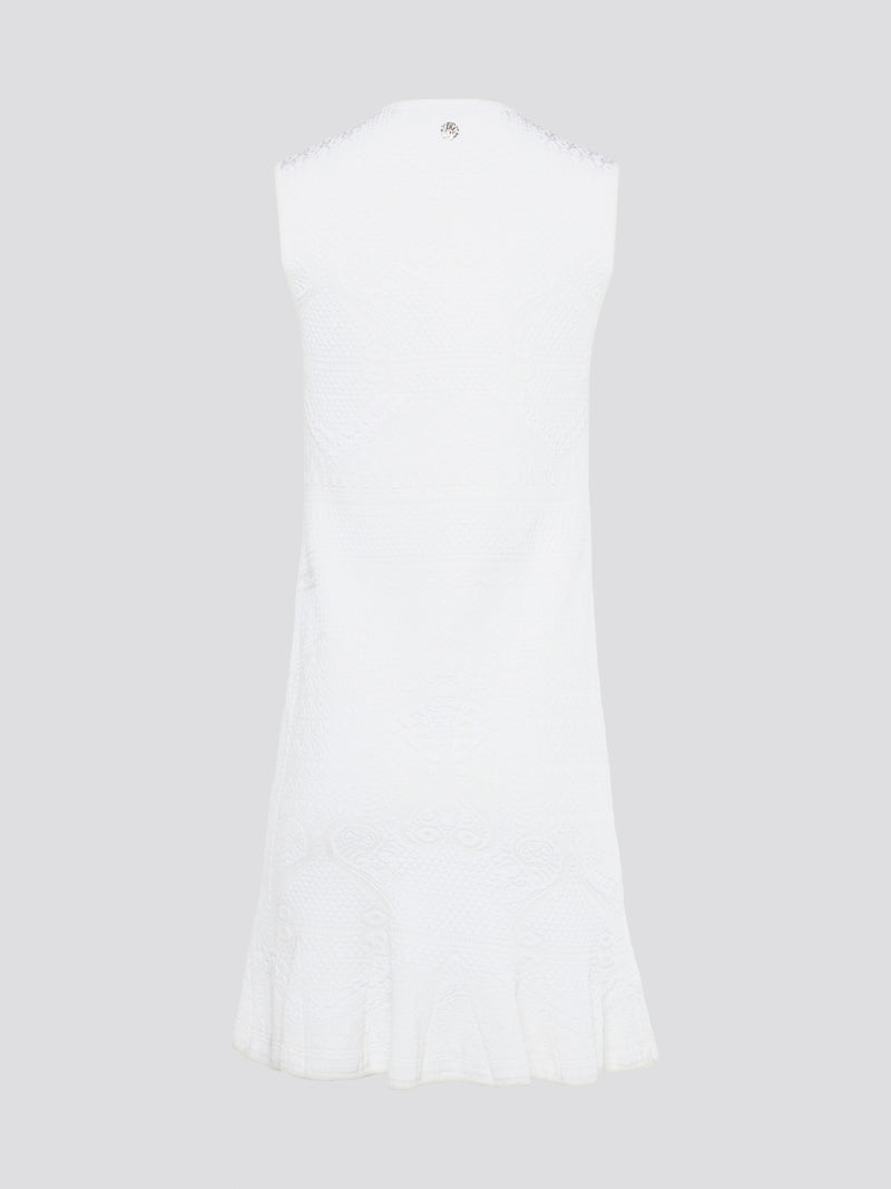 Feel effortlessly chic and sophisticated in this stunning White Sleeveless Mini Dress by Roberto Cavalli. The epitome of Italian luxury, the dress features a flattering silhouette and intricate detailing that is sure to turn heads. Perfect for any occasion, whether it's a summer soirée or a glamorous night out, this dress is a must-have for any fashion-forward woman.