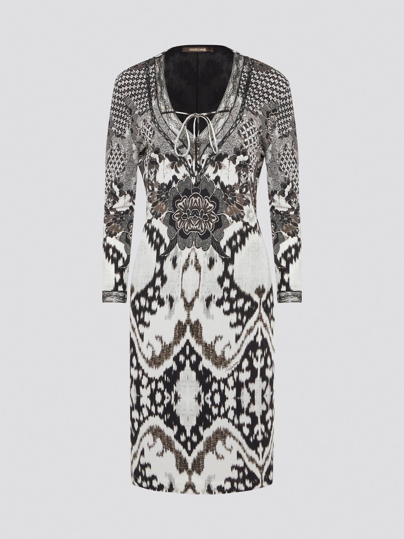 Elevate your wardrobe with this stunning Printed Long Sleeve Dress by Roberto Cavalli. The vibrant print and luxurious fabric make it a perfect choice for any special occasion or night out. Stand out in style and turn heads wherever you go in this show-stopping piece.