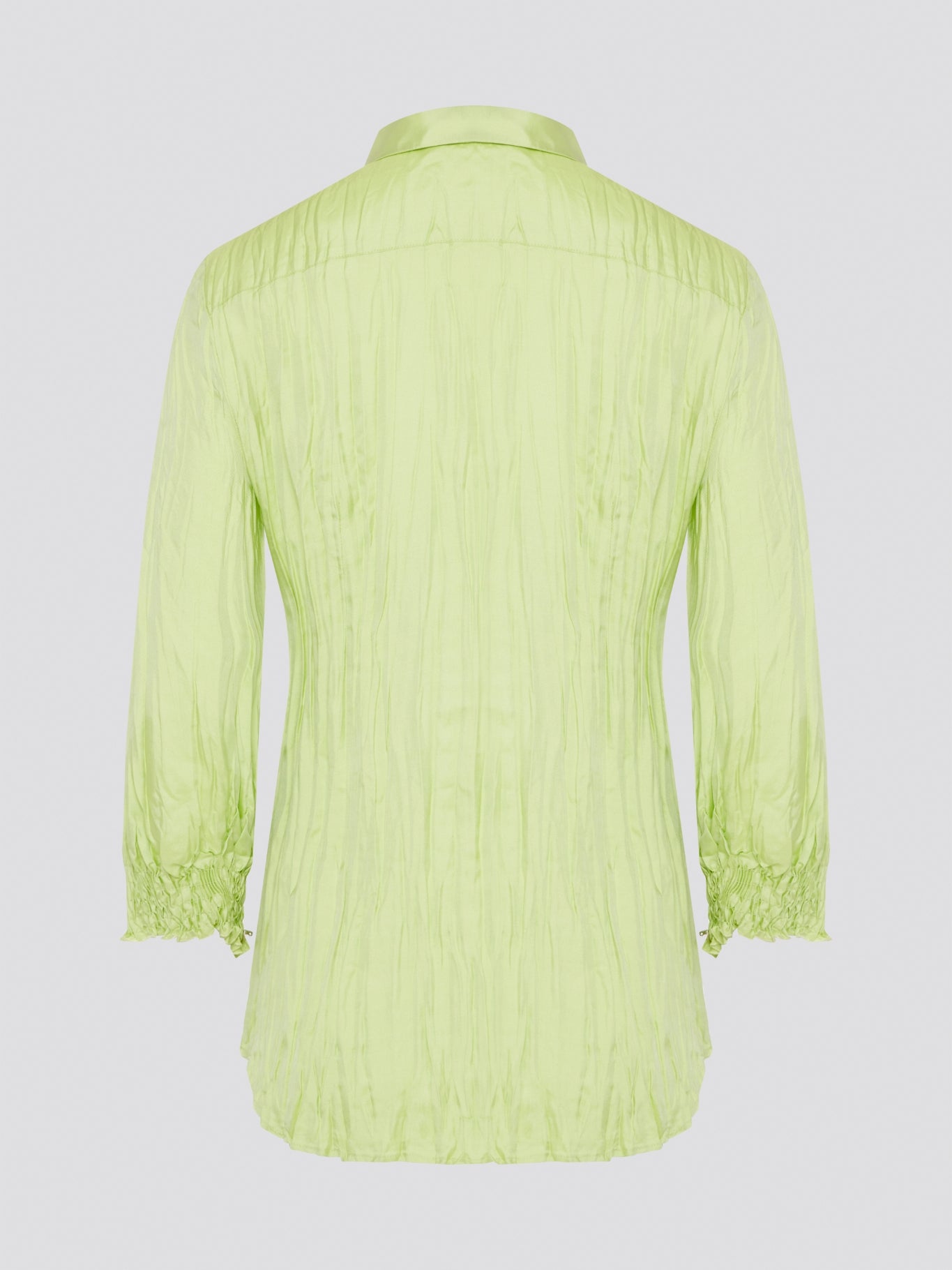 Step into the wild side with this striking green crinkled shirt from Roberto Cavalli. The vibrant hue and unique texture of the fabric will ensure you stand out from the crowd wherever you go. Embrace your fearless fashion sense and unleash your inner style icon with this must-have statement piece.