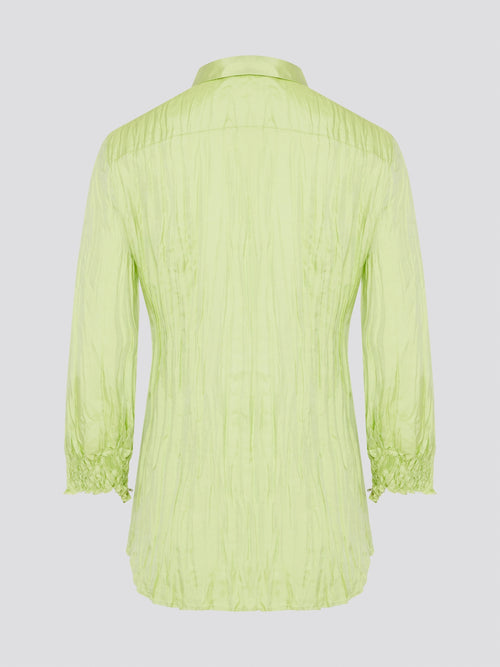 Step into the wild side with this striking green crinkled shirt from Roberto Cavalli. The vibrant hue and unique texture of the fabric will ensure you stand out from the crowd wherever you go. Embrace your fearless fashion sense and unleash your inner style icon with this must-have statement piece.