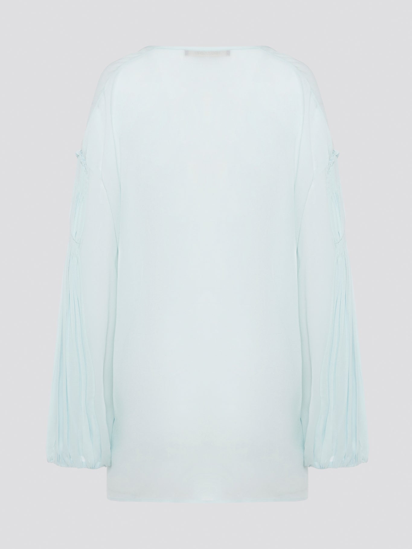 Step up your fashion game with this stunning Mint Green Tie Front Blouse by Roberto Cavalli. The delicate mint green hue and flattering tie front detail will make you stand out in any crowd. Pair it with your favorite jeans for a casual daytime look or dress it up with some sleek trousers for a night out on the town.